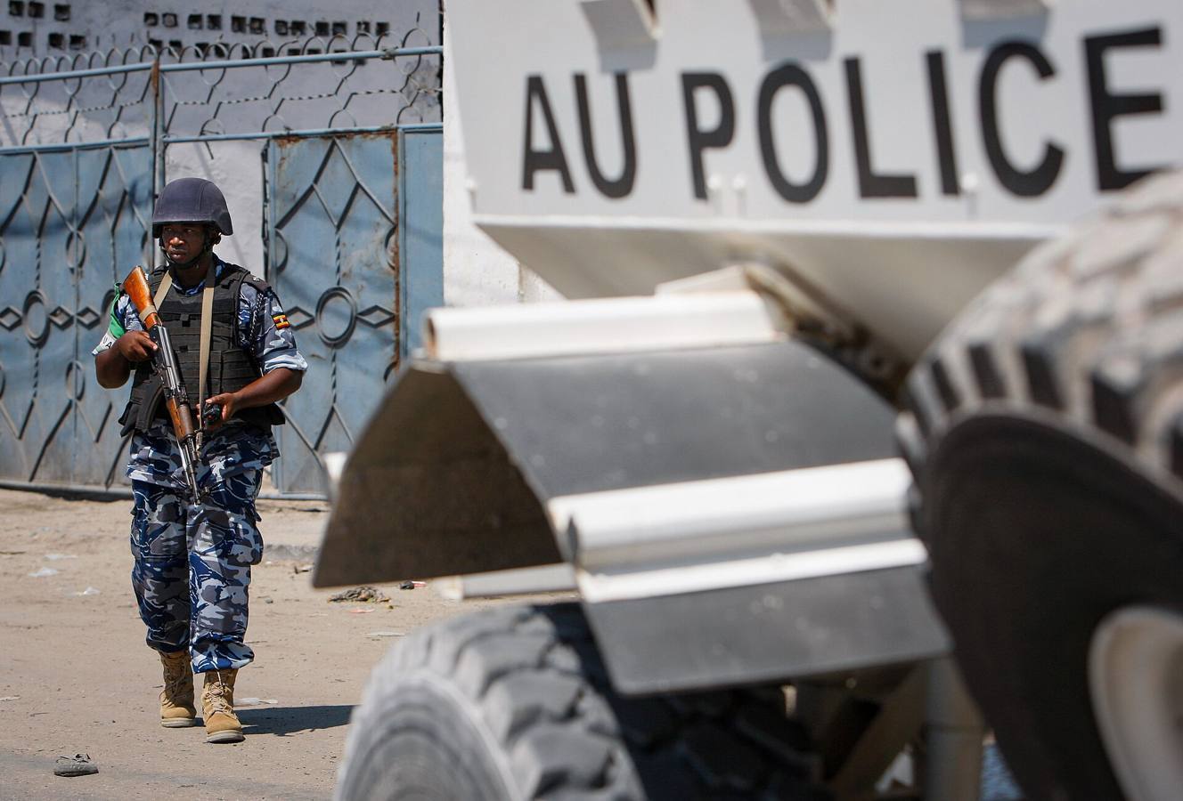 A Ugandan police officer with the African Union Mission in Somalia (AMISOM) on foot patrol near the seaport in Mogadishu, Somalia, 2012.